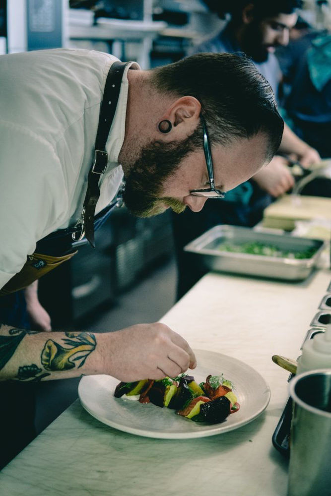 Chef Taylor McMeekin Plating Dish Featuring Local Food